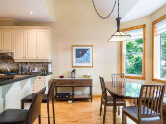 This stunning kitchen and dining area boasts a bright and airy atmosphere, perfect for entertaining or enjoying family meals.