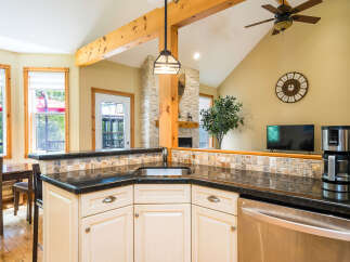 This stunning kitchen boasts a seamless blend of rustic charm and modern convenience.