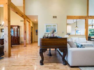 This stunning property boasts a spacious and inviting living area, perfect for entertaining or relaxing.