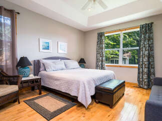 This inviting bedroom features a comfortable bed, perfect for relaxation.