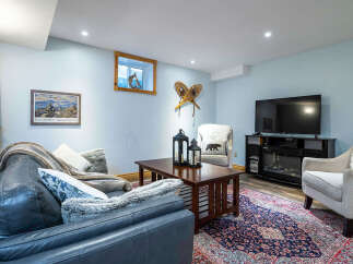 Step into this cozy living space, perfect for relaxing and entertaining.