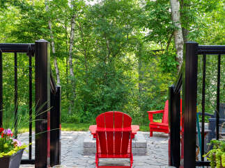 Enjoy the tranquility of this outdoor oasis! This property boasts a charming patio area, perfect for relaxation and entertaining.