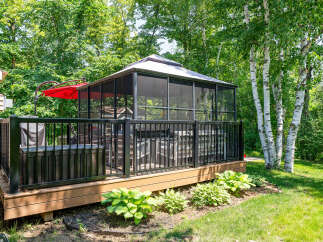 Enjoy outdoor living at its finest with this stunning property featuring a screened-in gazebo, perfect for relaxation and entertaining.