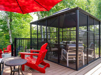 Enjoy outdoor living in this stunning property featuring a screened-in gazebo, perfect for relaxation and entertaining.