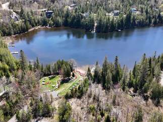Discover a serene lakeside retreat with this stunning property.