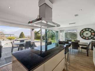 Experience luxury living in this stunning kitchen with panoramic views.