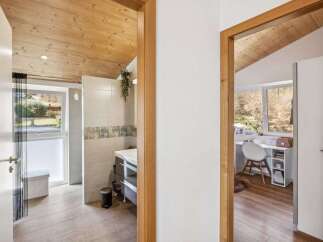 Step into this beautifully designed home and discover a harmonious blend of natural elements and modern comfort.