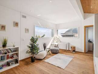 Discover the epitome of modern living in this stunning property, boasting a bright and airy interior with large windows that frame breathtaking mountain views.