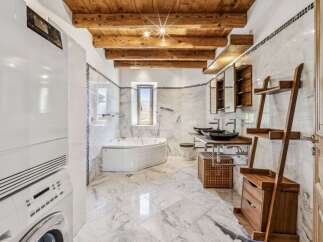 Step into luxury with this stunning bathroom featuring a spa-like ambiance.