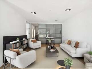 This modern living space is designed for comfort and style, featuring a sleek sofa and cozy armchairs.