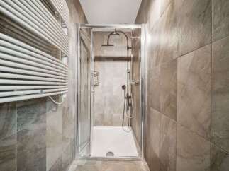 Step into a modern bathroom oasis! This image showcases a sleek shower enclosure, perfect for a refreshing start to your day.
