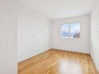 This bright and airy room features stunning views and a warm, inviting atmosphere.