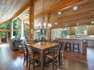 Experience luxury living in this stunning home featuring a spacious open floor plan and exquisite wooden details.
