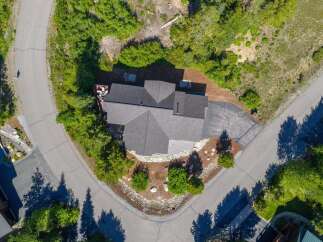 Discover a stunning property nestled in a serene, tree-lined setting.