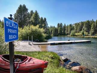 Discover the tranquility of this private beach, perfect for kayaking and enjoying the serene lake.