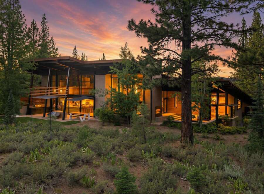 Experience modern luxury in this stunning contemporary home nestled amongst mature trees.