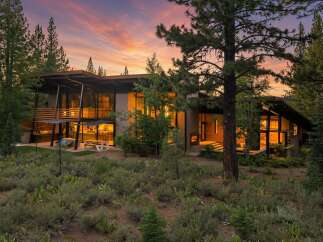 Experience modern luxury in this stunning contemporary home nestled amongst mature trees.