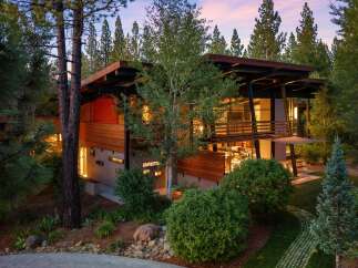 Experience modern luxury in this stunning contemporary home nestled amongst towering trees.