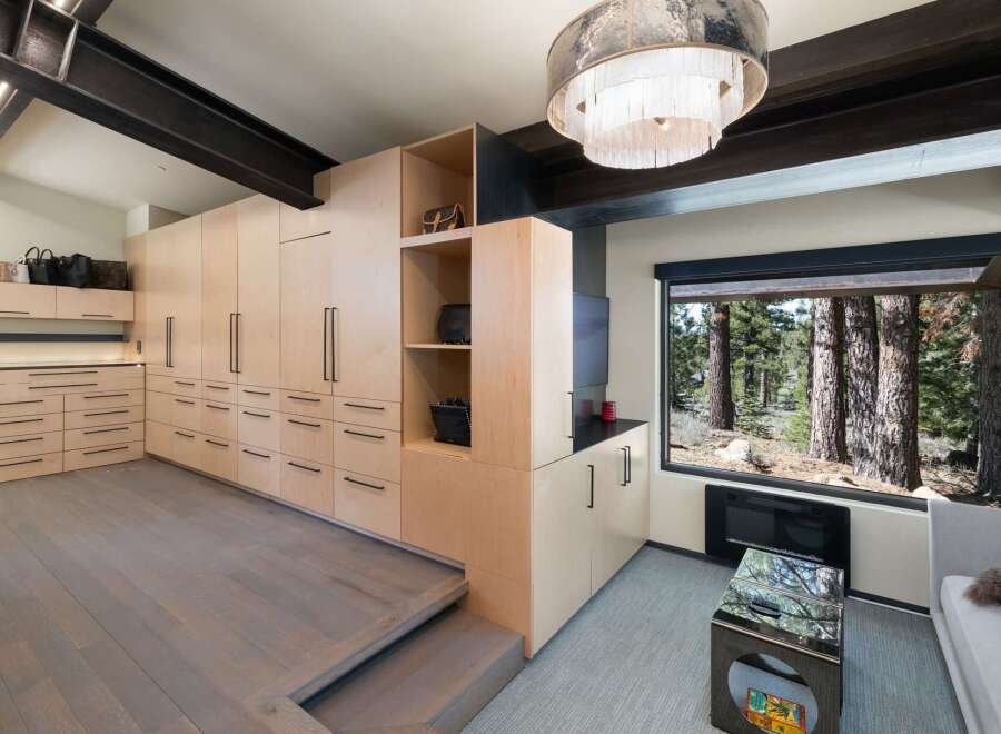 Experience unparalleled luxury and organization in this stunning modern home, featuring custom floor-to-ceiling cabinetry that maximizes storage and enhances the sleek aesthetic.
