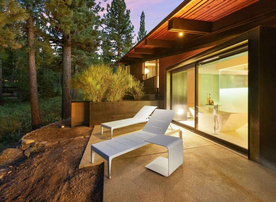Experience luxury living with this stunning modern home featuring a spacious patio perfect for relaxation and entertaining.