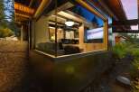Experience modern living with this stunning home featuring a large picture window that seamlessly blends indoor and outdoor spaces.