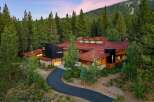 Experience luxury mountain living in this stunning contemporary home nestled amidst a serene pine forest.