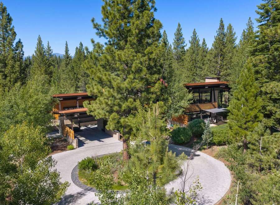 Nestled amidst a serene forest, this modern architectural masterpiece offers a luxurious retreat.
