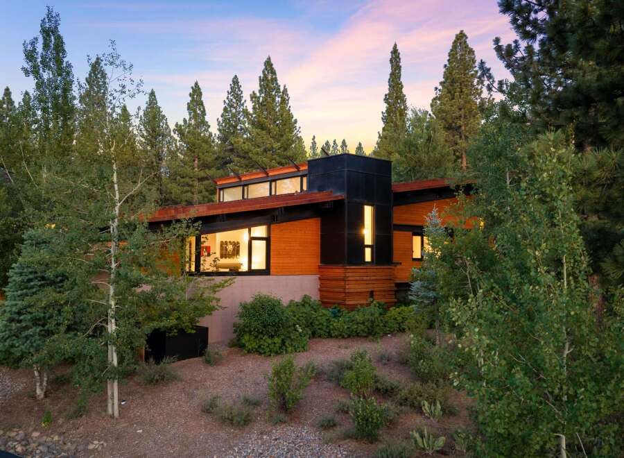 Experience modern mountain living in this stunning architectural home nestled amongst mature trees.