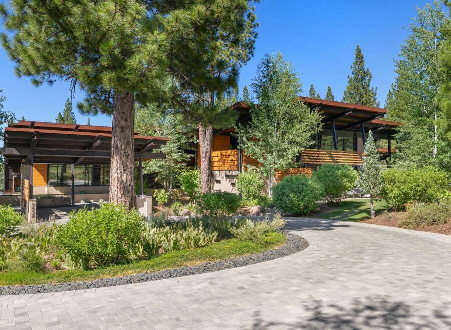 Discover modern mountain living in this stunning architectural home, nestled amongst mature pine trees.