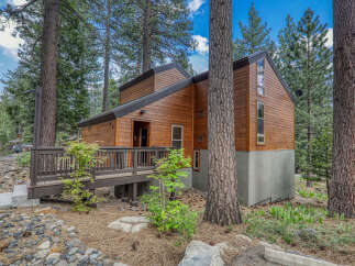 Nestled in a serene wooded setting, this charming cabin offers a perfect blend of rustic charm and modern comfort.