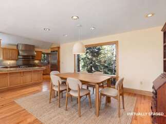 Step into this beautifully staged dining area, perfect for hosting gatherings.