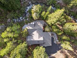 Nestled amidst lush greenery and a serene river, this stunning property offers a unique blend of natural beauty and modern living.