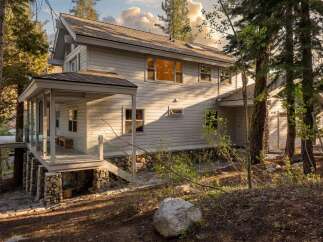Nestled in a serene, wooded setting, this stunning property offers a perfect blend of nature and luxury.