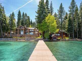 Experience lakeside luxury at this stunning property, featuring a private dock and crystal-clear waters.