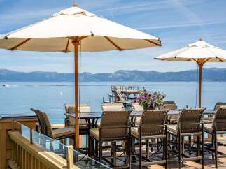 Enjoy breathtaking lake views from this stunning outdoor dining area.