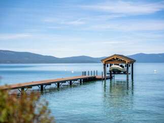 Enjoy serene lakefront living with this stunning property featuring a private dock and boat lift.