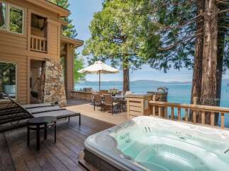 Experience luxury living with this stunning property featuring a private hot tub and breathtaking lake views.