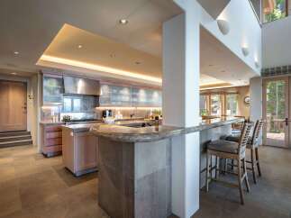 This stunning kitchen boasts a modern design with high-end finishes.