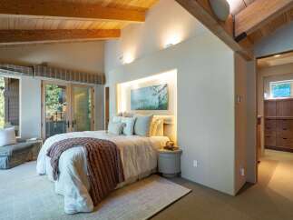 This stunning bedroom boasts a cozy and inviting atmosphere, perfect for relaxation.