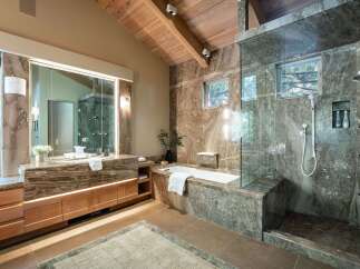 Indulge in luxury within this stunning bathroom, featuring exquisite marble finishes and a spa-like ambiance.