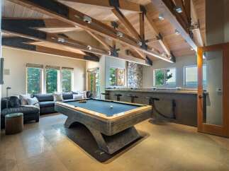 This stunning property boasts a luxurious game room, perfect for entertaining guests.
