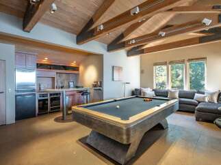 This stunning property features a luxurious game room, perfect for entertaining guests.