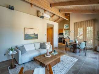 Step into luxury with this stunning property, showcasing a harmonious blend of modern design and natural elements.