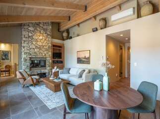 Step into luxury with this stunning property featuring a cozy stone fireplace, perfect for those chilly evenings.