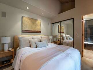 This stunning bedroom boasts a modern design with a touch of elegance.