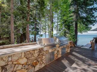 Enjoy outdoor cooking and entertaining with this stunning lakeside property.