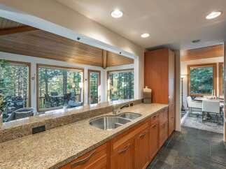 This stunning kitchen boasts a seamless blend of natural light and modern design.
