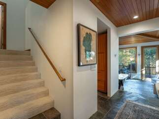 Step into luxury with this stunning property, featuring a beautifully designed staircase leading to the upper levels.