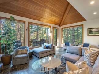 Step into luxury with this stunning living room, boasting a seamless blend of modern design and natural beauty.