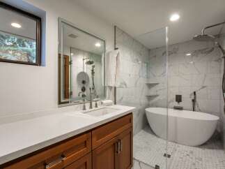 Step into luxury with this stunning bathroom featuring a modern design and high-end finishes.